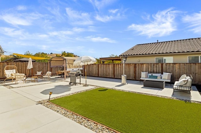 view of yard with an outdoor living space and a patio