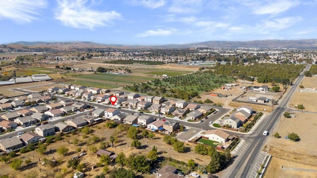 birds eye view of property with a mountain view