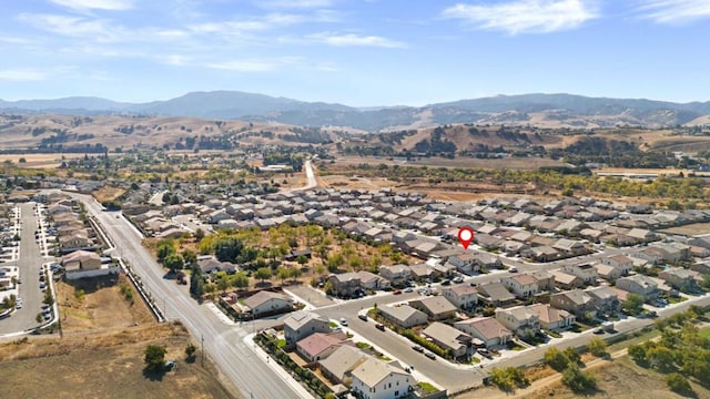 birds eye view of property with a mountain view