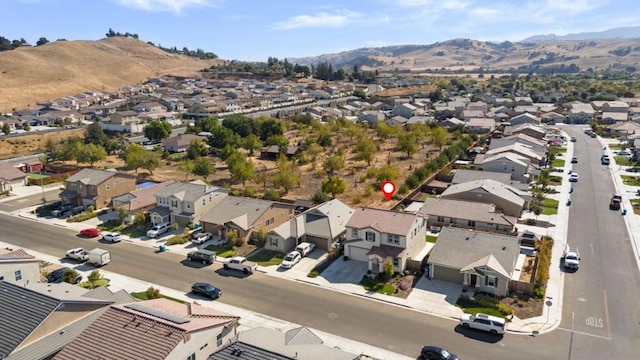 birds eye view of property with a mountain view