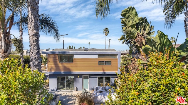 rear view of property with a patio