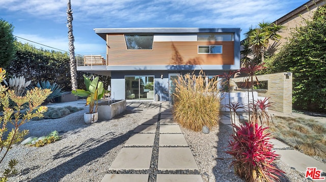 back of house with a patio