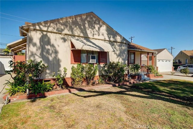 view of front of house with a garage and a front lawn