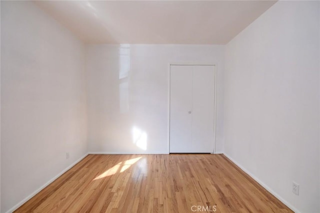 unfurnished room featuring light hardwood / wood-style flooring