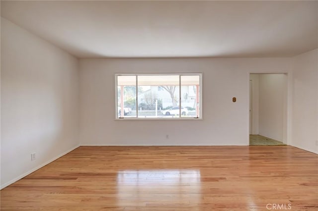 unfurnished room featuring light hardwood / wood-style floors