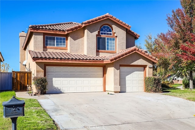 mediterranean / spanish house featuring a garage