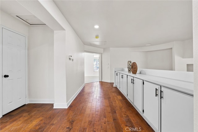 hallway featuring dark hardwood / wood-style floors