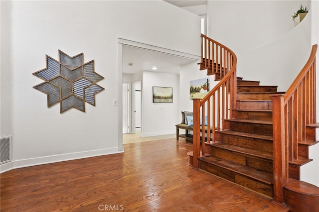 stairs with wood-type flooring