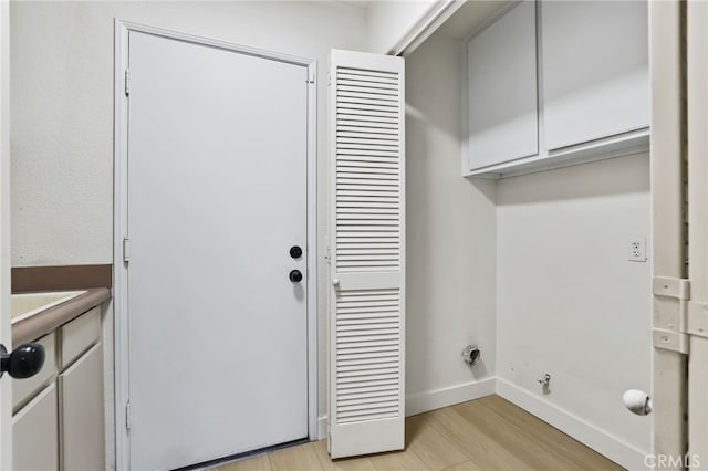 washroom with light hardwood / wood-style flooring