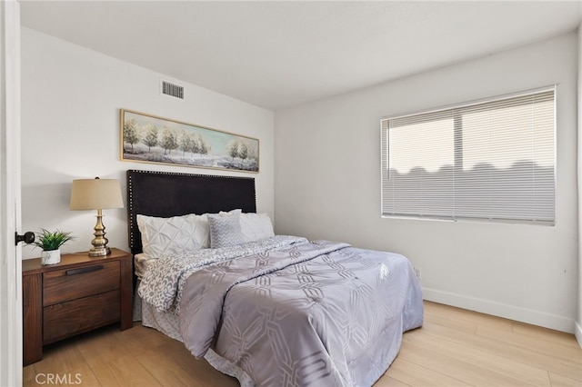 bedroom with light hardwood / wood-style flooring