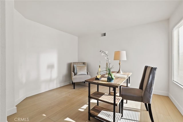 sitting room with light hardwood / wood-style floors