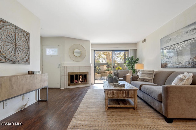 living room featuring a fireplace and hardwood / wood-style flooring