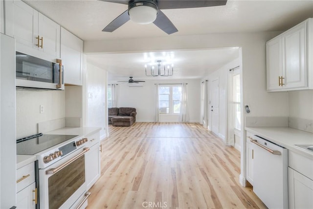 kitchen with white cabinetry, light hardwood / wood-style floors, and white appliances