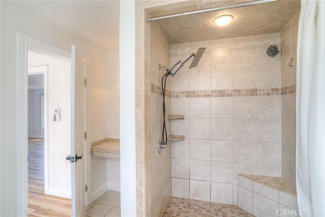 bathroom featuring hardwood / wood-style floors and walk in shower