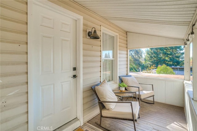 exterior space featuring vaulted ceiling