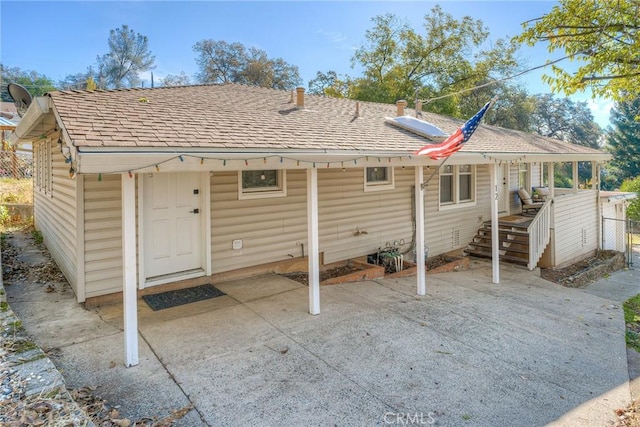 back of property with a patio