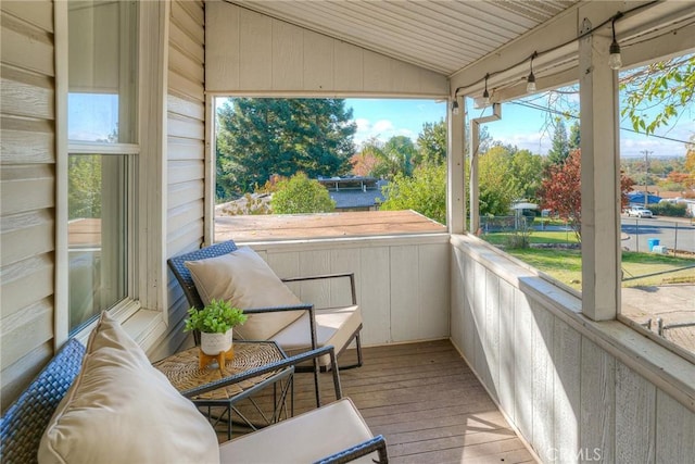 sunroom with lofted ceiling and wooden ceiling