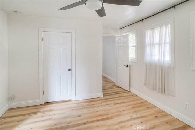 unfurnished bedroom featuring light hardwood / wood-style flooring and ceiling fan