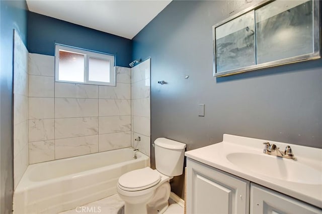 full bathroom featuring tiled shower / bath combo, toilet, and vanity