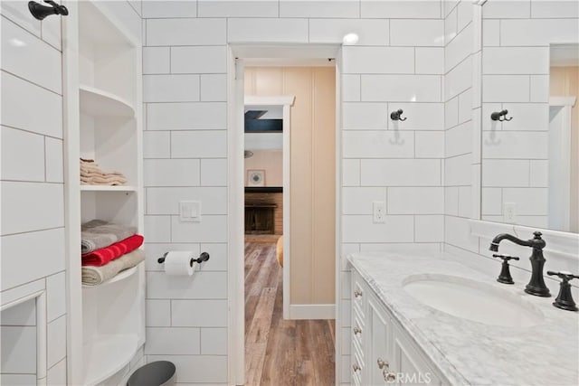 bathroom with hardwood / wood-style floors and vanity