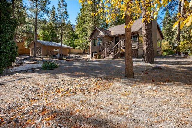 view of front of property featuring a wooden deck