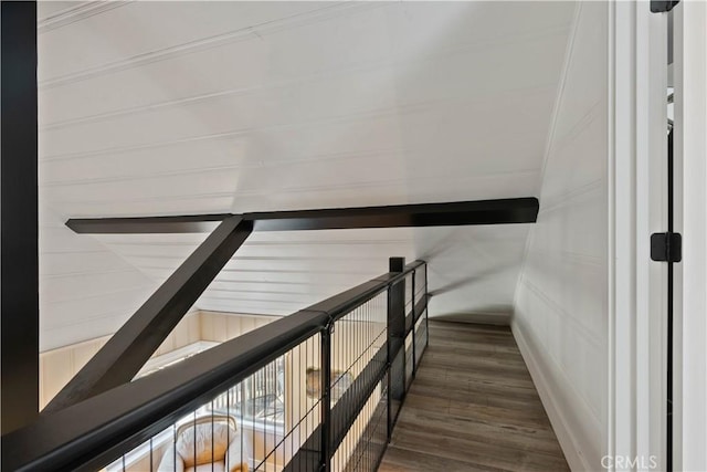 stairway featuring wood-type flooring