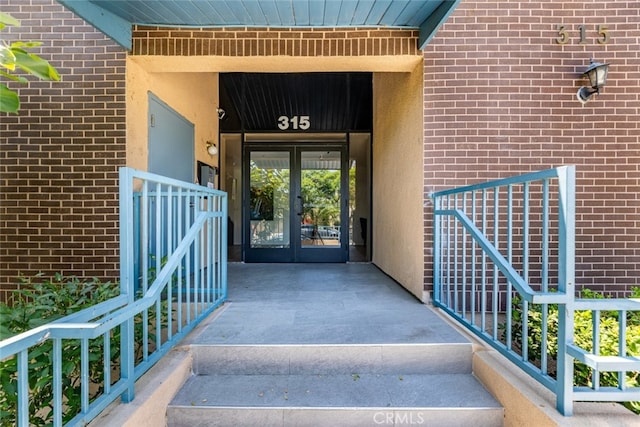 view of exterior entry featuring french doors