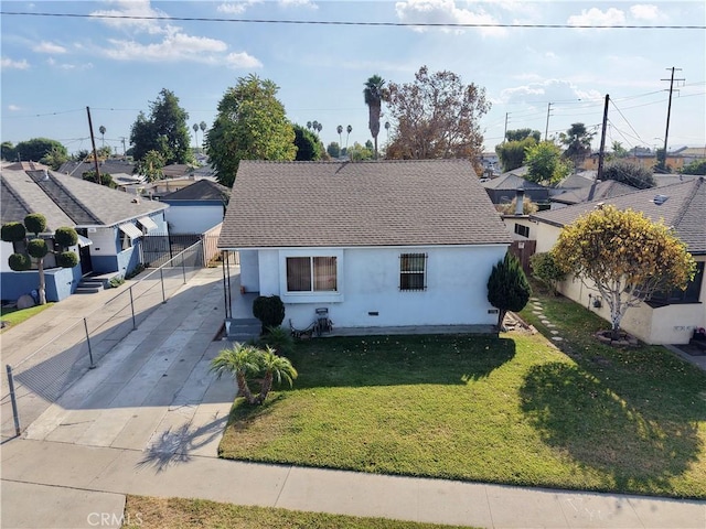 bungalow-style house with a front lawn