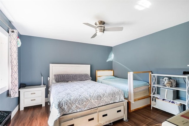 bedroom featuring dark hardwood / wood-style flooring and ceiling fan