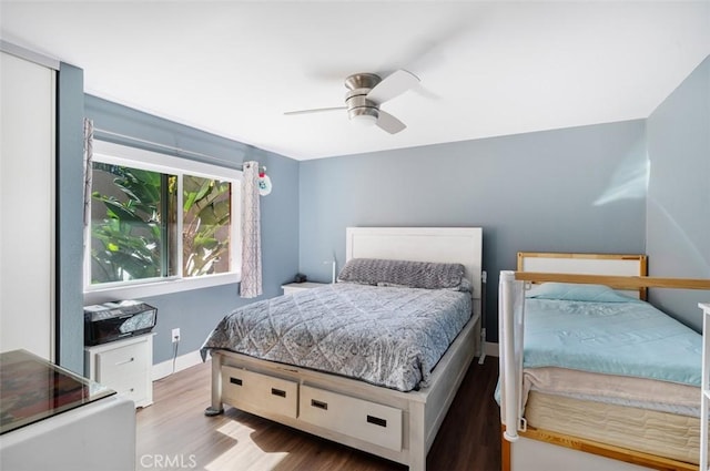 bedroom featuring light wood-type flooring and ceiling fan