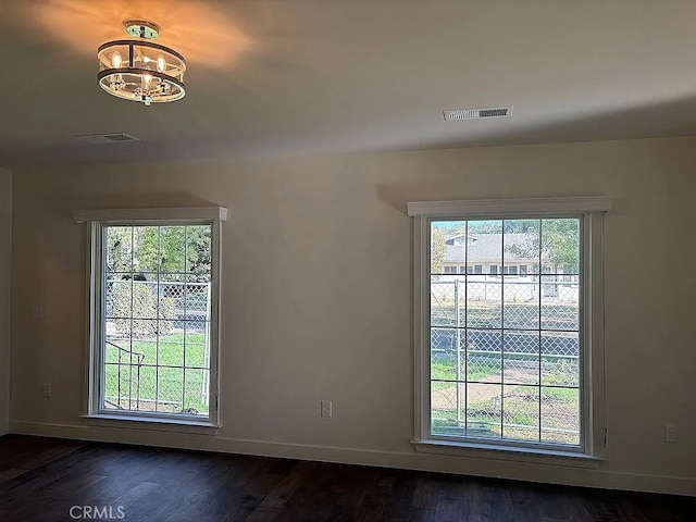 unfurnished room featuring dark wood-type flooring