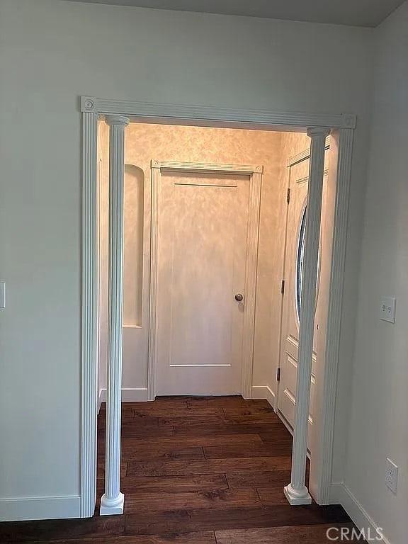 entryway with dark hardwood / wood-style floors