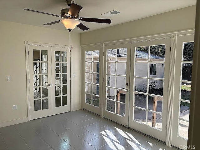 entryway featuring french doors and ceiling fan