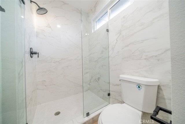 bathroom with an enclosed shower and toilet