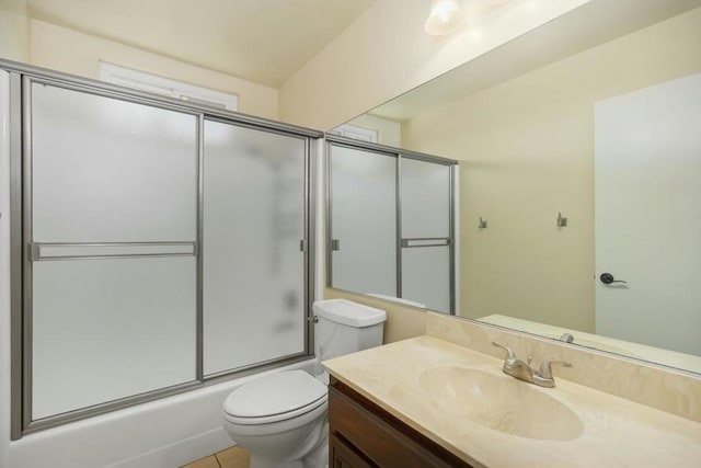 full bathroom with vanity, tile patterned floors, shower / bath combination with glass door, and toilet