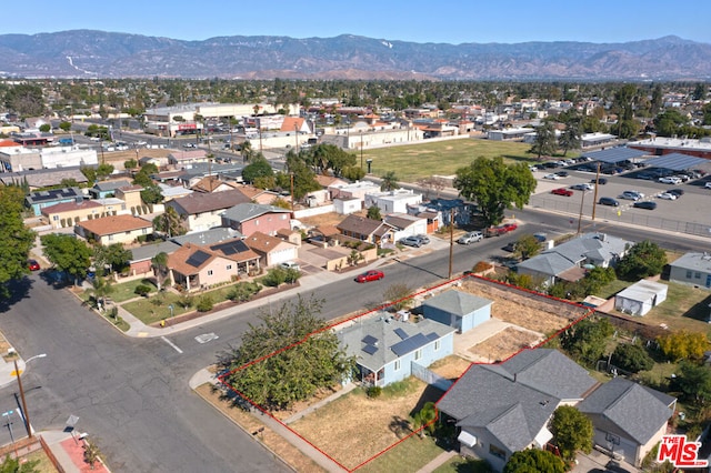 drone / aerial view featuring a mountain view