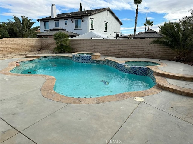 view of pool featuring an in ground hot tub and a patio