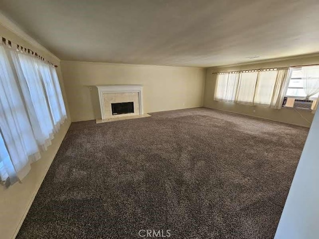 unfurnished living room featuring carpet flooring and cooling unit