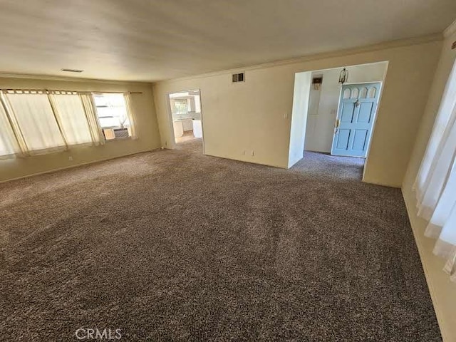 unfurnished room featuring cooling unit, crown molding, and carpet floors