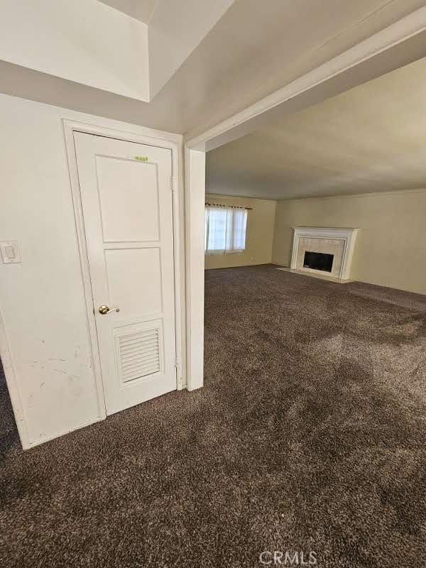 unfurnished living room with carpet