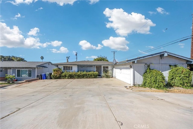 single story home featuring a garage