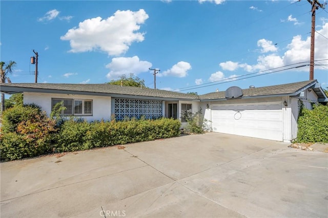 ranch-style home featuring a garage