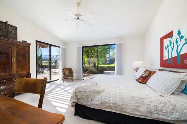 bedroom featuring access to outside, multiple windows, light carpet, and ceiling fan