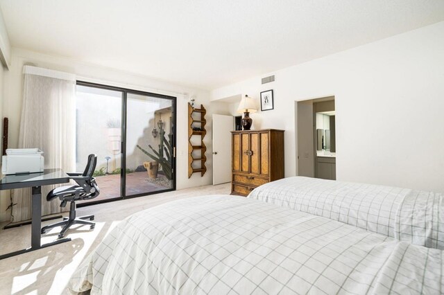 bedroom featuring light colored carpet and access to outside