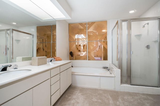 bathroom featuring vanity and separate shower and tub