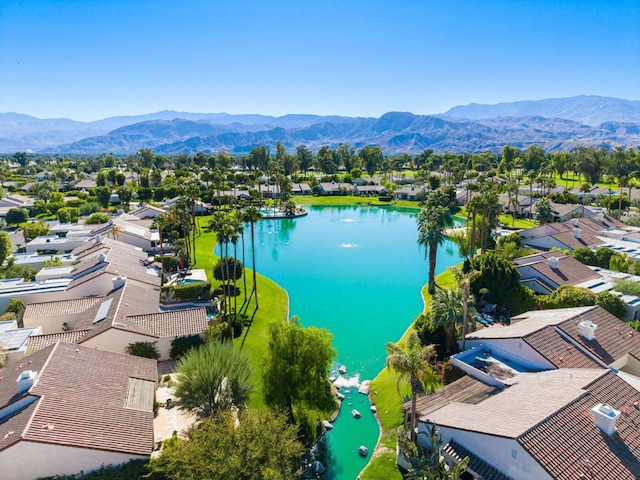 bird's eye view with a water and mountain view