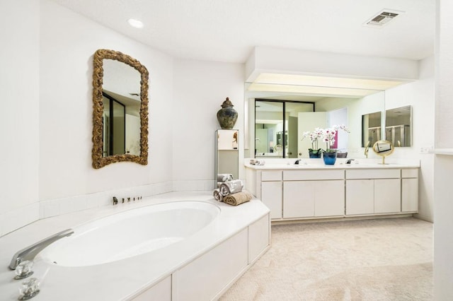 bathroom featuring a tub and vanity