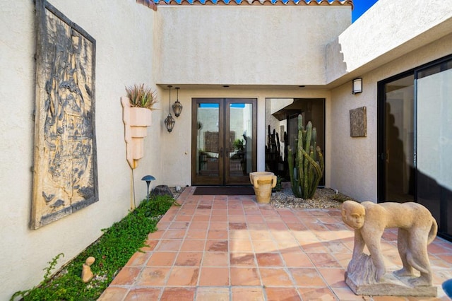 property entrance with french doors and a patio