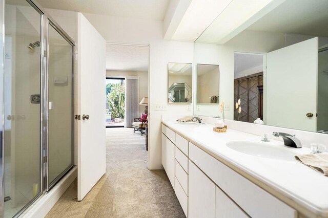 bathroom with vanity and walk in shower