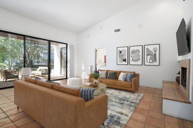 tiled living room with high vaulted ceiling